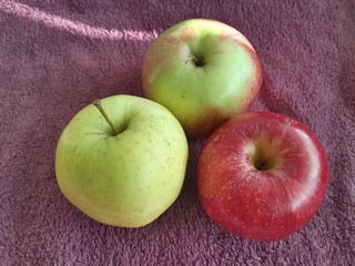 apple on a maroon background