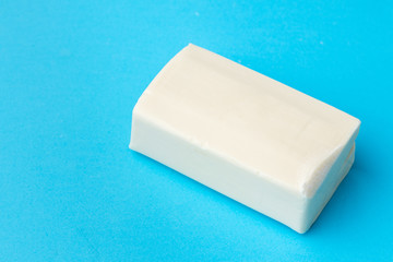 Soap for hand washing on a blue background. Close up