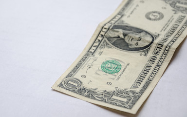 One dollar on a white background.