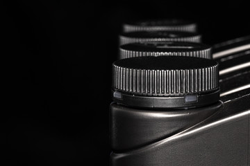 Engine oil bottle on black background.