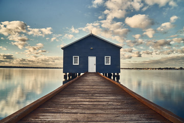 Rustic blue house on the water