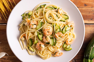 Spaghetti with shrimps and zucchini. Typical dish on italian cuisine. Summer lunch.