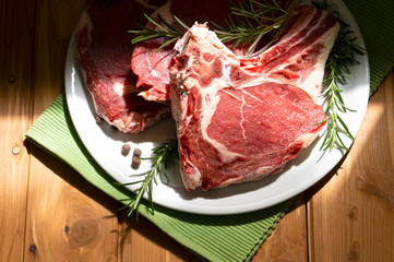 dish with steak on the wooden table