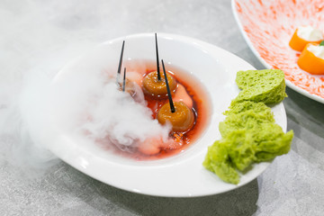 Molecular cuisine. Molecular food. Borsch - a traditional Ukrainian dish. Green bread.
