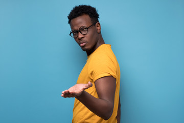 African american man looking suspicious and some disgust on his face