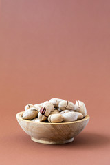 Pecan nuts in a wooden plate.Healthy nutrition. Food Vegetarian.