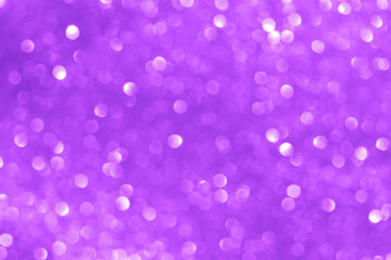 Purple light glitter bokeh texture background.  Concept for New Year, Christmas, and All Celebrations.
