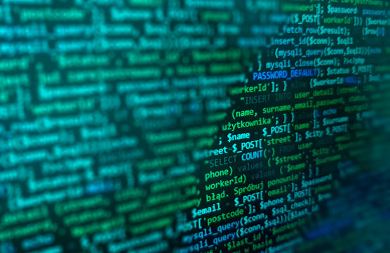 Programming code on monitor screen. Developer work. Abstract background for search job. HTML, php web programming source code.