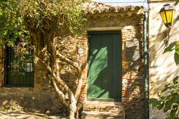 Facade of an old stone building in Colonia del Sacramento, Uruguay. It is one of the oldest towns in Uruguay