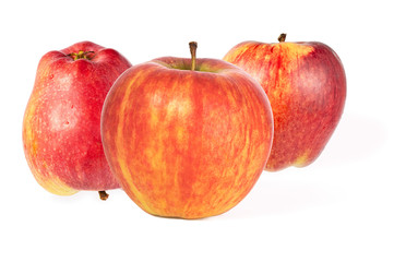 three red striped ripe juicy apples isolated on a white background