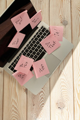 Image of laptop full of sticky notes reminders on screen. Work overload concept image. Coworking or...