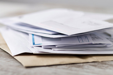 A stack of professional or invoice letters