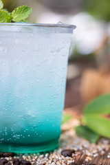 a cup of sweet soda ice on wooden floor