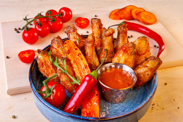 meat dish on a plate with vegetables and spices