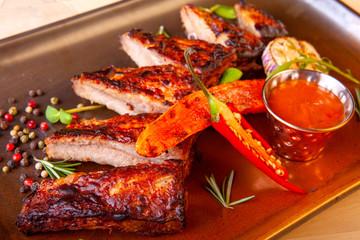 meat dish on a plate with vegetables and spices