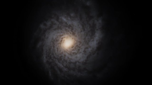 Spiral galaxy rotation in outer space closes up from above it.
