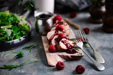 Pork tenderloin with raspberry sauce.