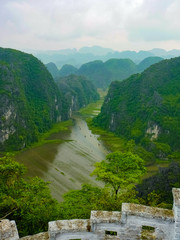 Fototapeta na wymiar View on Tam Coc river from the top of Hang Mua Pagoda in Ninh Binh, Vietnam