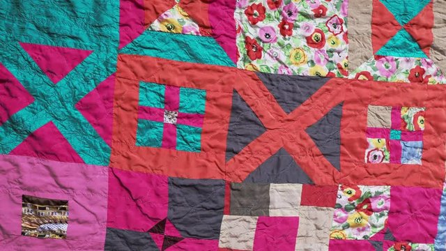 panoraming of surface of stitched crumpled patchwork scarf