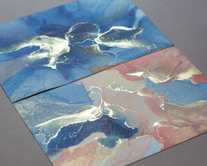 A fragment of alcohol ink painting (coral, blue and gold colors). Abstract colorful background, wallpaper. Mixing acrylic paints. Modern art. Marble texture. Alcohol ink colors translucent. Abstract c