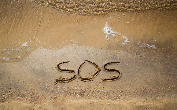 Inscription Sos In The Sand