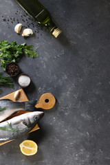 Fototapeta na wymiar Fresh fish seabass and ingredients for cooking.