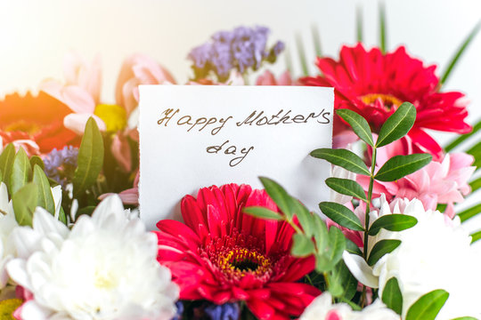 Happy mother's day greeting card in a beautiful bright bouquet of flowers 