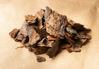 Heap of Pine Tree Bark Chip on Old Paper Background