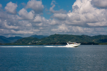 Fototapeta na wymiar Speed boat moves by sea