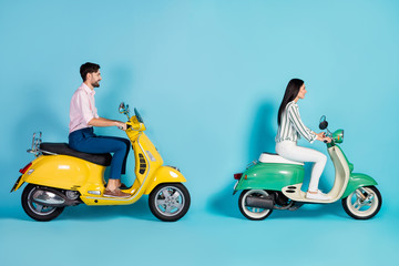 Full size profile side photo of positive cheerful man girl drive yellow green chopper enjoy freedom journey wear white striped shirt pants trousers pink isolated over blue color background