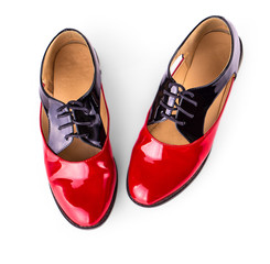 red women shoes with shoelaces on white background