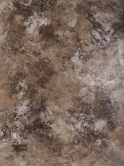 Plastered, painted, rough and beige or light brown concrete or stone wall. High resolution full frame textured background.
