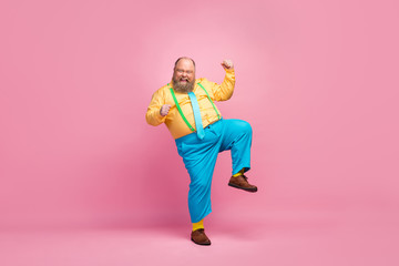 Full length body size view of his he nice funky crazy carefree positive glad bearded guy dancing having fun good mood rejoicing isolated over pink pastel color background