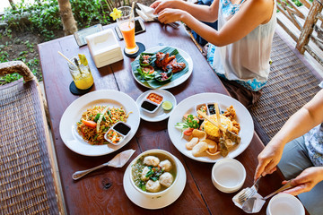 Close up of Indonesian food on a wooden table