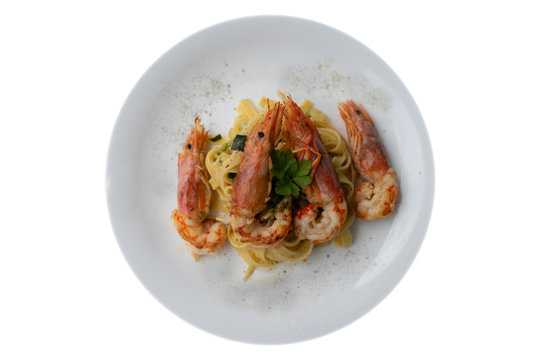 Typical seafood noodles (tagliatelle) with tiger prawns. Italian food in summer day. Healthy and food concept - Image