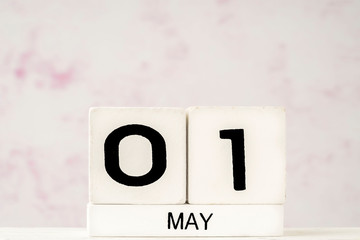 White cube calendar for May with copy space