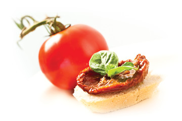 Italian bruschetta, with dried tomato and basil