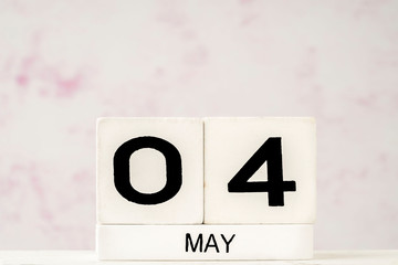 White cube calendar for May with copy space
