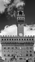 Beautiful vertical black and white view of the famous Palazzo Vecchio palace in Piazza della Signoria in Florence, Italy, on a sunny day