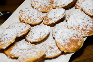 Street food dessert: waffles and small dutch pancakes
