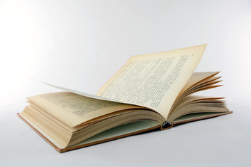 Obraz premium open old book on a white background