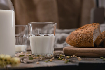 Rustic breakfast with milk and bread on World Milk Day, first of June. Horizontal shot.
