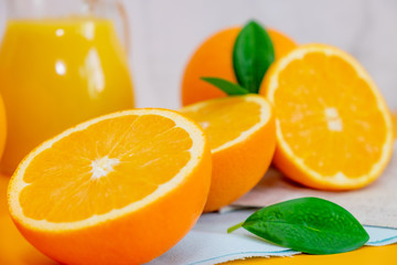 Orange juice with oranges on yellow background