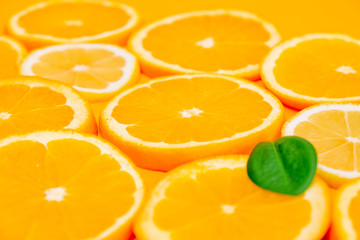 Orange slices on yellow background