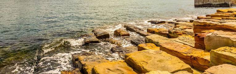 Beautiful sandstone foreshore of the Barangaroo Reserve in Sydney, Australia.