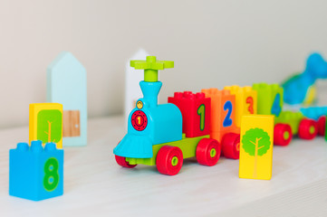 Kids plastic toy train with colorful number cubes