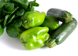 Green peppers, zucchini and spinach on a white background. Culinary products. Vitamins