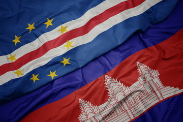 waving colorful flag of cambodia and national flag of cape verde.