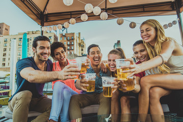 Group of friends having party on a rooftop