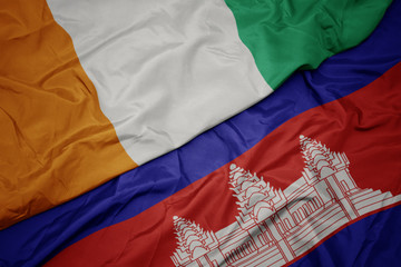 waving colorful flag of cambodia and national flag of cote divoire.